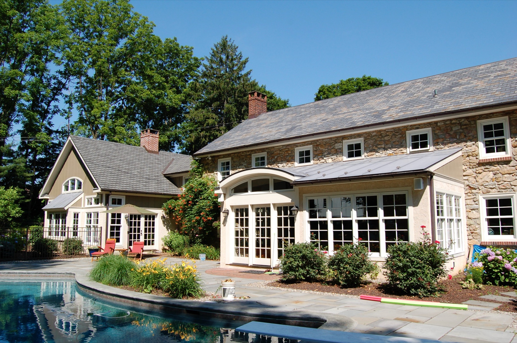 Historic stone Sproger Residence with a complementary addition and pool